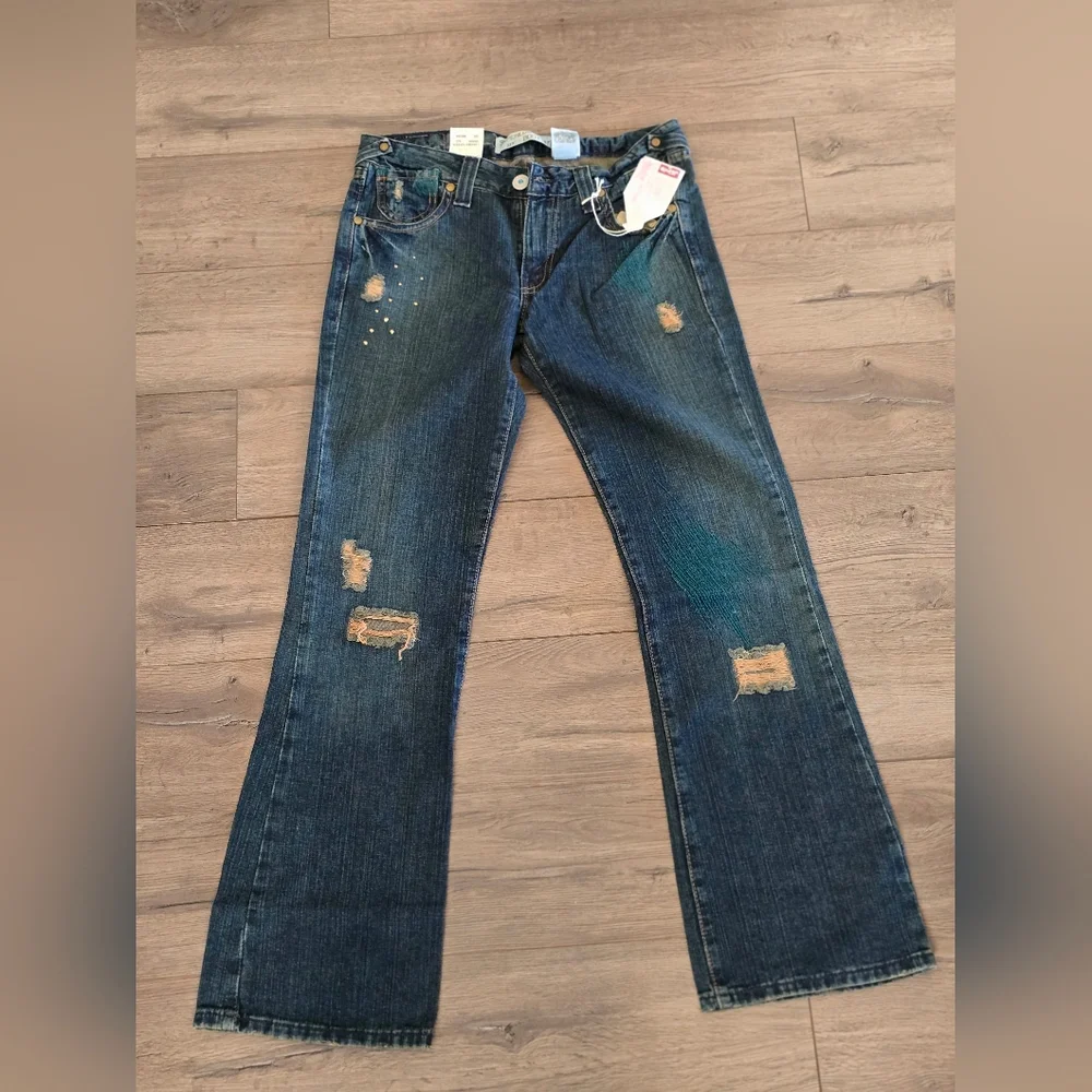 Levi's Distressed Flare Jeans in Dark Blue - Picture 1 of 2